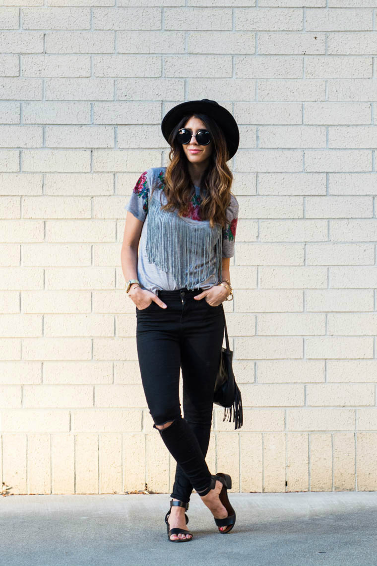 Fringe top, black distressed jeans, hat, sandals