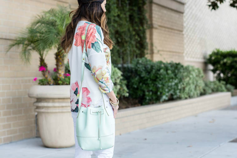 Floral top, mint bag, white jeans