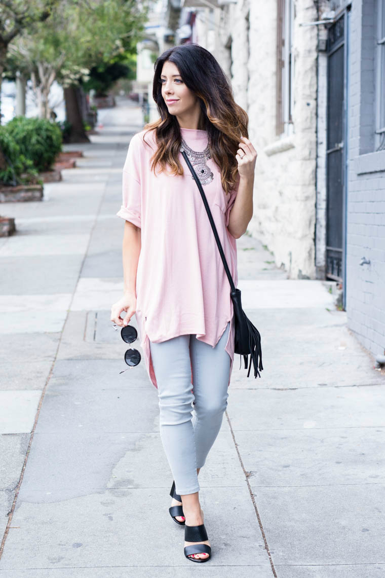 Grey jeans, pink top, round sunniesm black mules