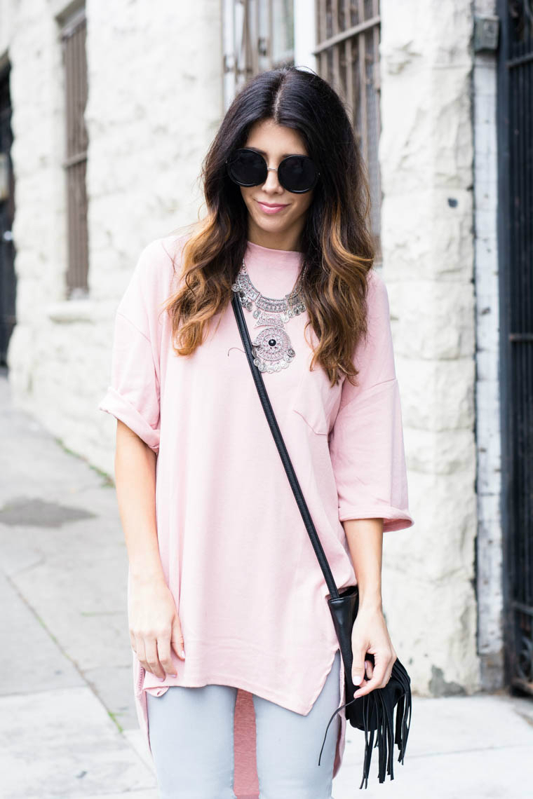 Sliver jewels, pink top, round sunglasses