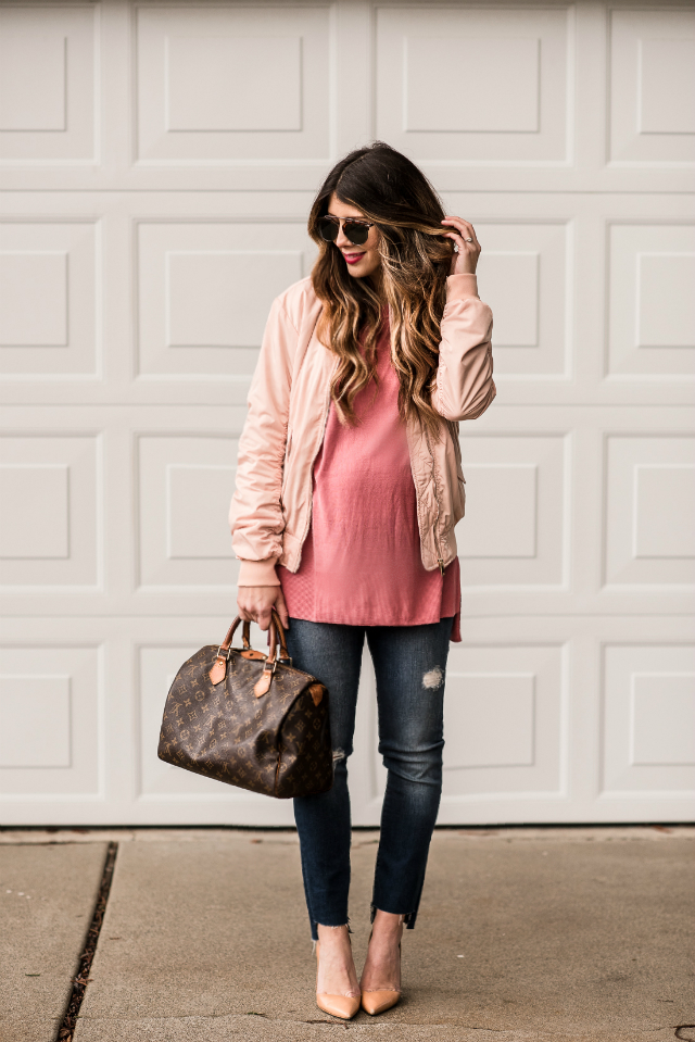 Casual Valentine's Day Look styled by top US fashion blog, The Girl in the Yellow Dress: image of a woman wearing a H&M pink bomber jacket, H&M pink sweater, Joe’s Crop skinny jeans, pink Sam Edelman heels, Louis Vuitton satchel and Karen Walker sunglasses