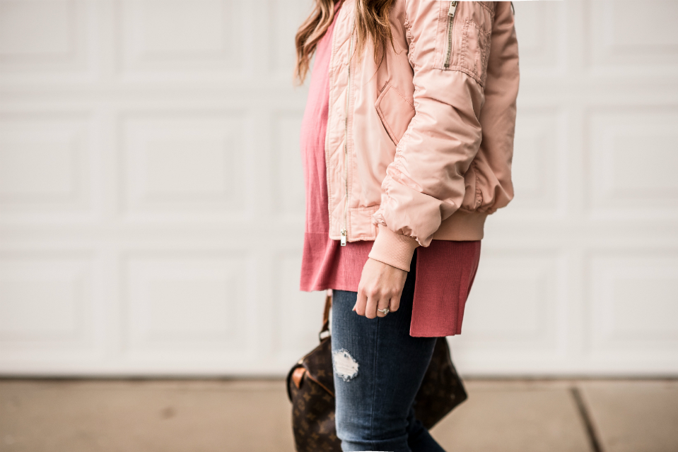 Casual Valentine's Day Look styled by top US fashion blog, The Girl in the Yellow Dress: image of a woman wearing a H&M pink bomber jacket, H&M pink sweater, Joe’s Crop skinny jeans, pink Sam Edelman heels, Louis Vuitton satchel and Karen Walker sunglasses