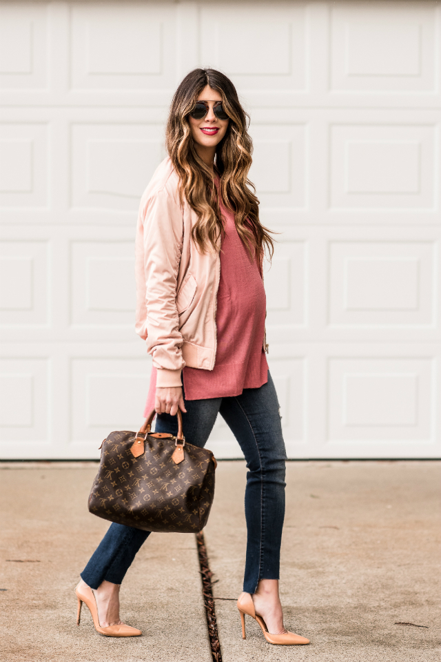 Casual Valentine's Day Look styled by top US fashion blog, The Girl in the Yellow Dress: image of a woman wearing a H&M pink bomber jacket, H&M pink sweater, Joe’s Crop skinny jeans, pink Sam Edelman heels, Louis Vuitton satchel and Karen Walker sunglasses