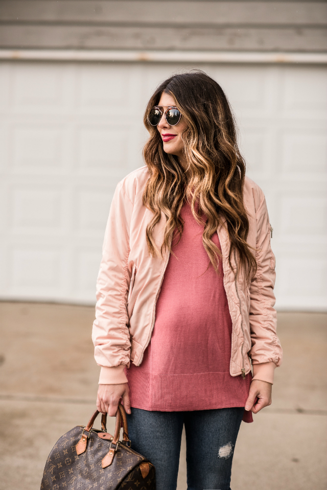 Casual Valentine's Day Look styled by top US fashion blog, The Girl in the Yellow Dress: image of a woman wearing a H&M pink bomber jacket, H&M pink sweater, Joe’s Crop skinny jeans, pink Sam Edelman heels, Louis Vuitton satchel and Karen Walker sunglasses