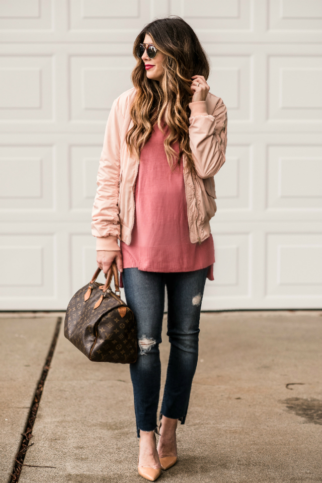 Casual Valentine's Day Look styled by top US fashion blog, The Girl in the Yellow Dress: image of a woman wearing a H&M pink bomber jacket, H&M pink sweater, Joe’s Crop skinny jeans, pink Sam Edelman heels, Louis Vuitton satchel and Karen Walker sunglasses