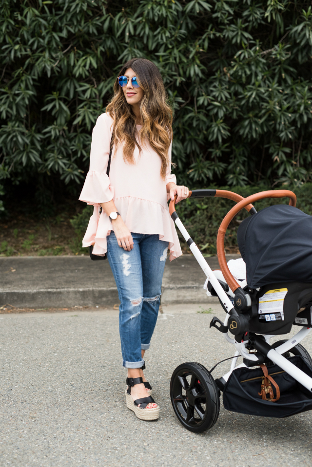 Spring Shoe Trends featured by top US fashion blog The Girl in the Yellow Dress; Image of a woman wearing Gibson ruffle top, AG jeans, Marc Fisher wedges, Cluse watch and Ray-Ban sunglasses.