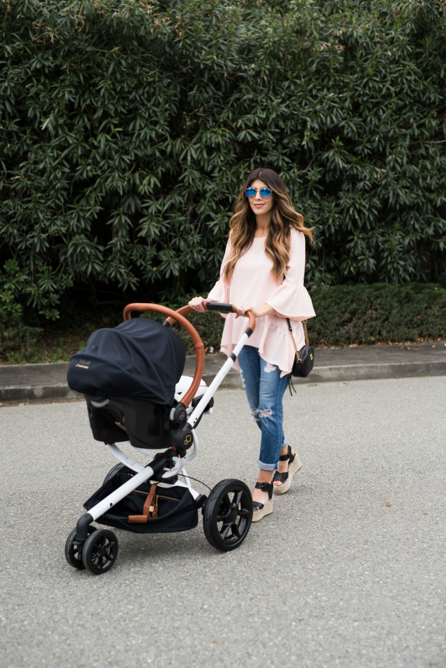 Spring Shoe Trends featured by top US fashion blog The Girl in the Yellow Dress; Image of a woman wearing Gibson ruffle top, AG jeans, Marc Fisher wedges, Cluse watch and Ray-Ban sunglasses.