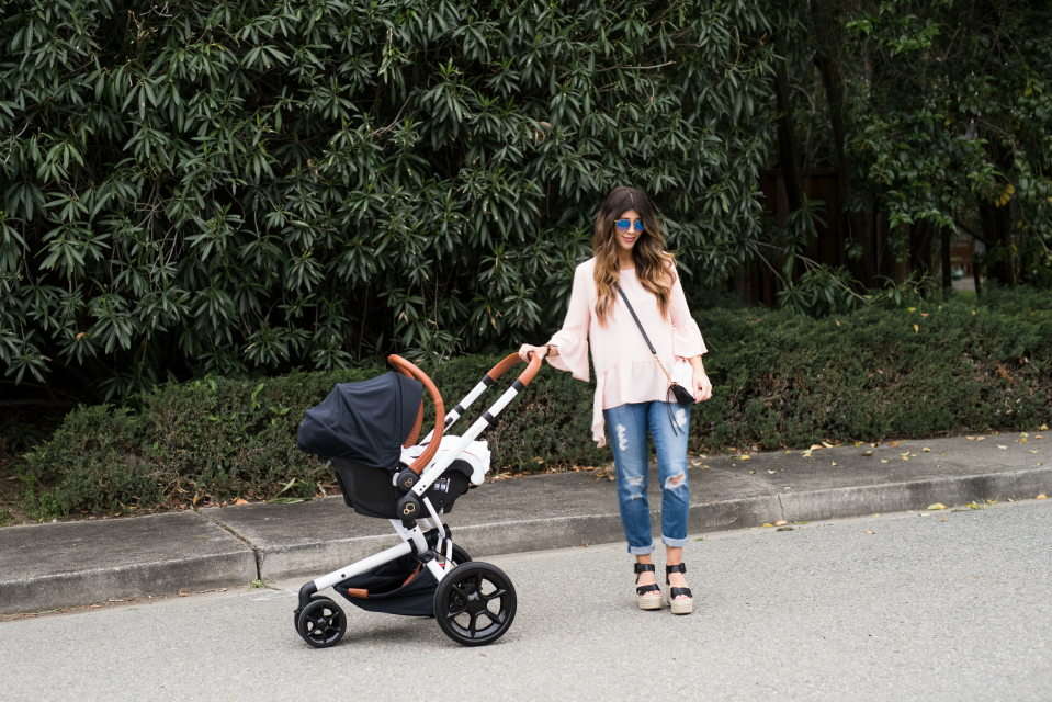 Spring Shoe Trends featured by top US fashion blog The Girl in the Yellow Dress; Image of a woman wearing Gibson ruffle top, AG jeans, Marc Fisher wedges, Cluse watch and Ray-Ban sunglasses.