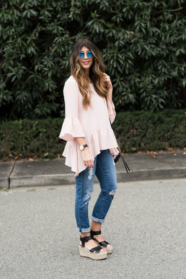 Spring Shoe Trends featured by top US fashion blog The Girl in the Yellow Dress; Image of a woman wearing Gibson ruffle top, AG jeans, Marc Fisher wedges, Cluse watch and Ray-Ban sunglasses.