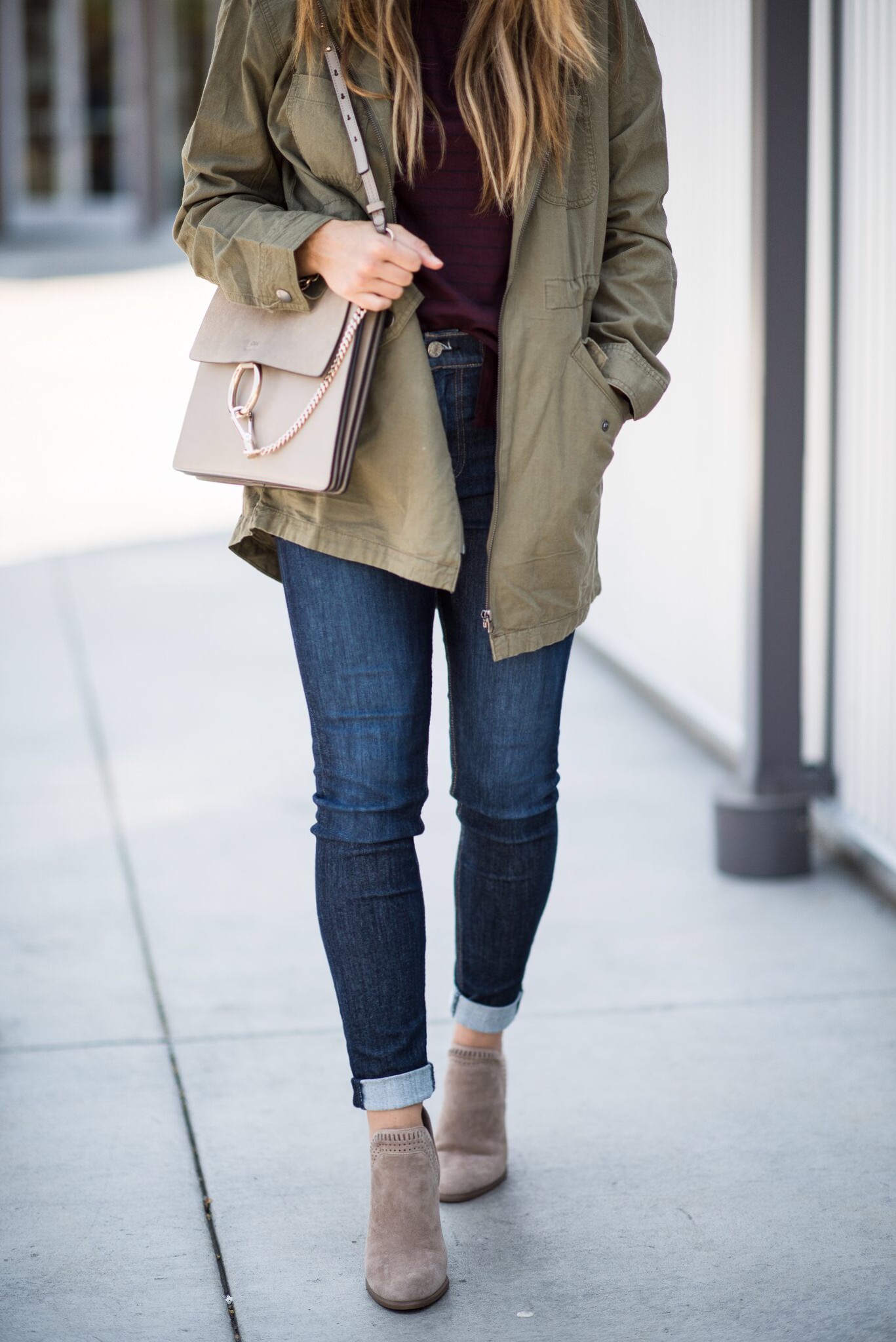 Fall Fashion, Taupe Booties, Olive Utility Jacket, Long Sleeve Tee, Dark Denim Jeans. Taupe Chloe Handbag