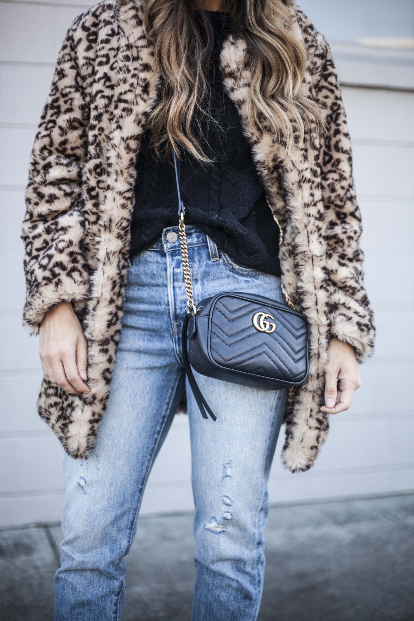 Leopard Faux Fur Coat, Levi Mom Jeans, Black Beanie, Black Cable Knit Sweater, Gucci Handbag, Mvmt Sunglasses