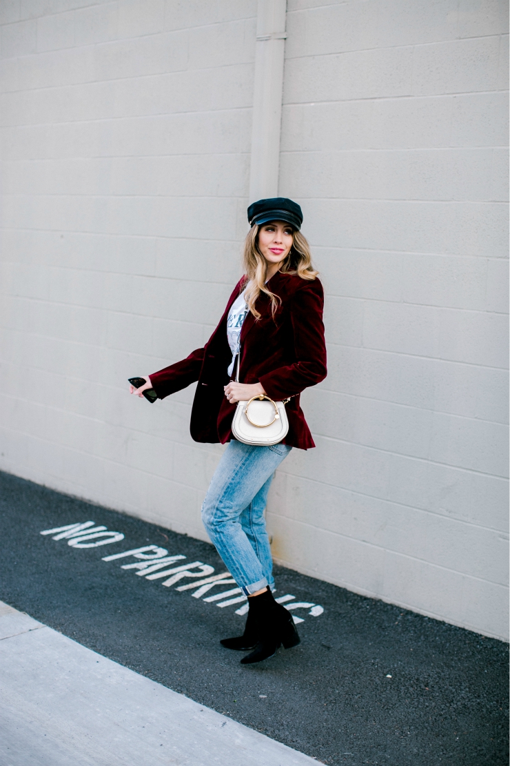 Cute Valentines Day Tops featured by top US fashion blog, The Girl in the Yellow Dress: image of a woman wearing a red Chicwish blazer, a TOPSHOP graphic tee, Levi’s mom jeans, Chloe bag, Brixton fiddler cap, Free People sunglasses and Jeffrey Campbell booties