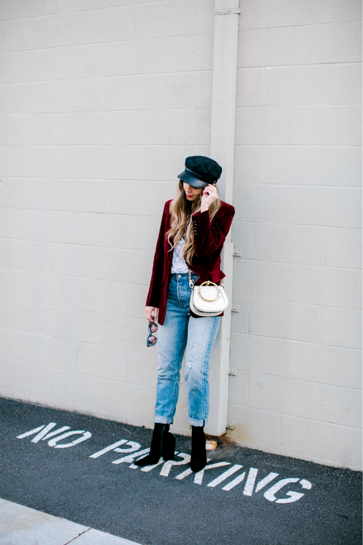 Cute Valentines Day Tops featured by top US fashion blog, The Girl in the Yellow Dress: image of a woman wearing a red Chicwish blazer, a TOPSHOP graphic tee, Levi’s mom jeans, Chloe bag, Brixton fiddler cap, Free People sunglasses and Jeffrey Campbell booties