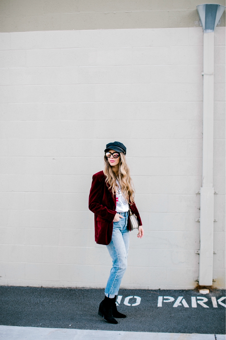 Cute Valentines Day Tops featured by top US fashion blog, The Girl in the Yellow Dress: image of a woman wearing a red Chicwish blazer, a TOPSHOP graphic tee, Levi’s mom jeans, Chloe bag, Brixton fiddler cap, Free People sunglasses and Jeffrey Campbell booties