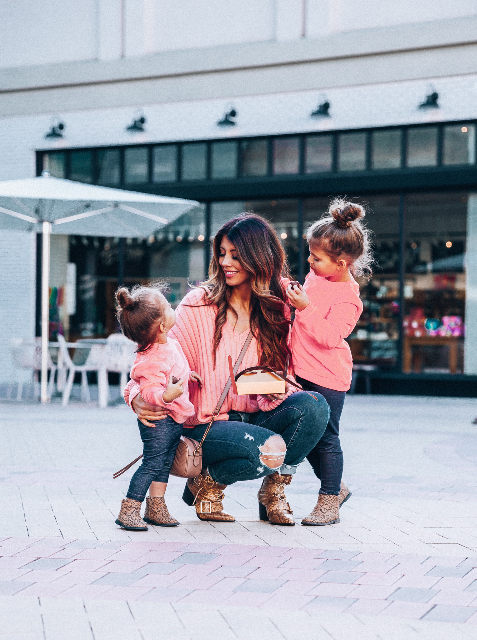 Mommy and Me Valentine's Day Outfit featured by top US fashion blog The Girl in the Yellow Dress; Image of a woman wearing a pink sweater and booties from Revolve.