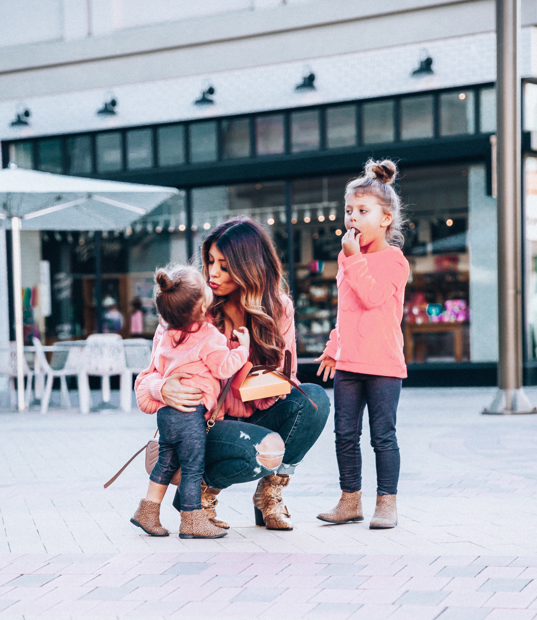 Mommy and Me Valentine's Day Outfit featured by top US fashion blog The Girl in the Yellow Dress; Image of a woman wearing a pink sweater and booties from Revolve.