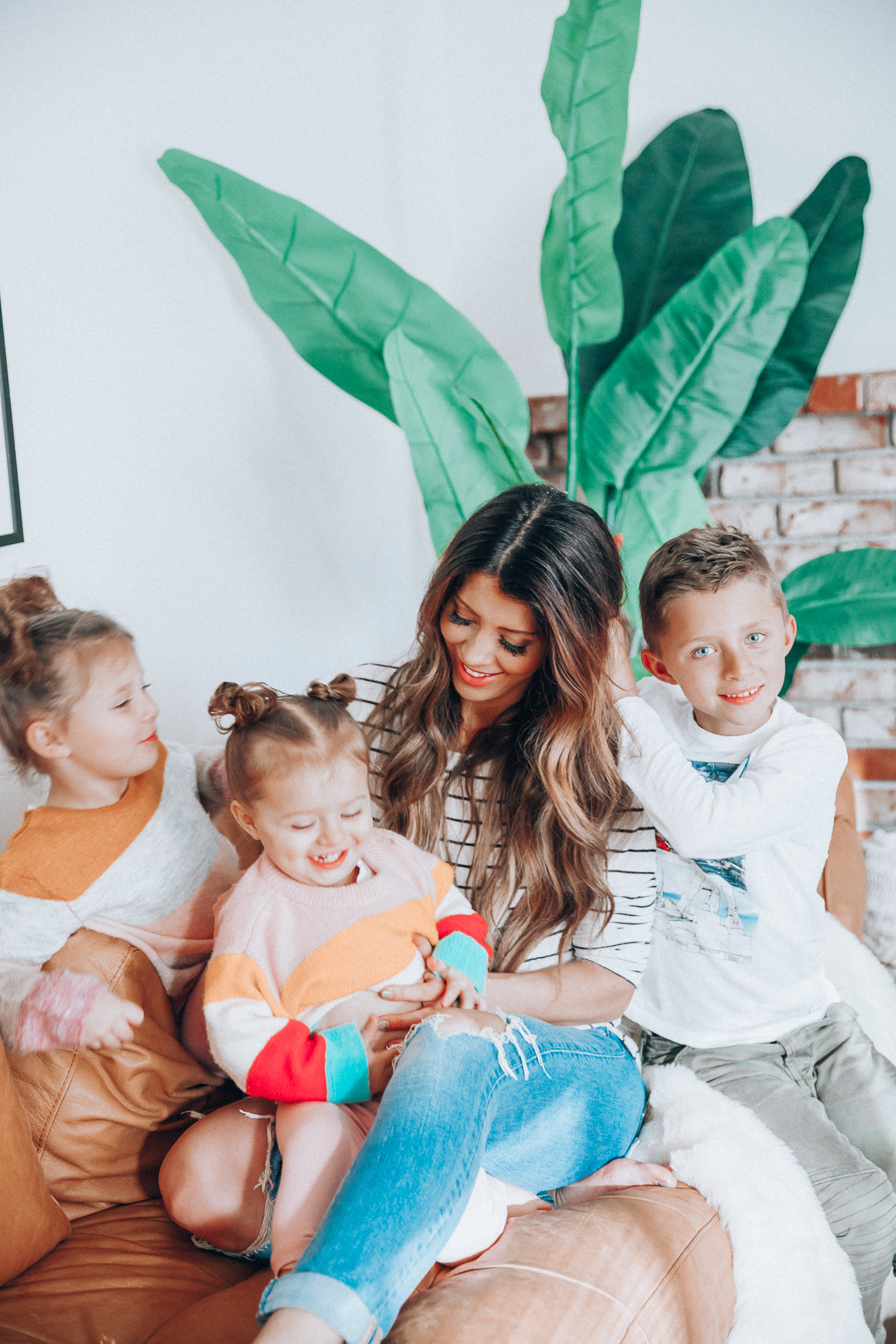 Family Update featured by top US lifestyle blog The Girl in the Yellow Dress; Image of a woman with her kids wearing BP striped tee and Levi's.