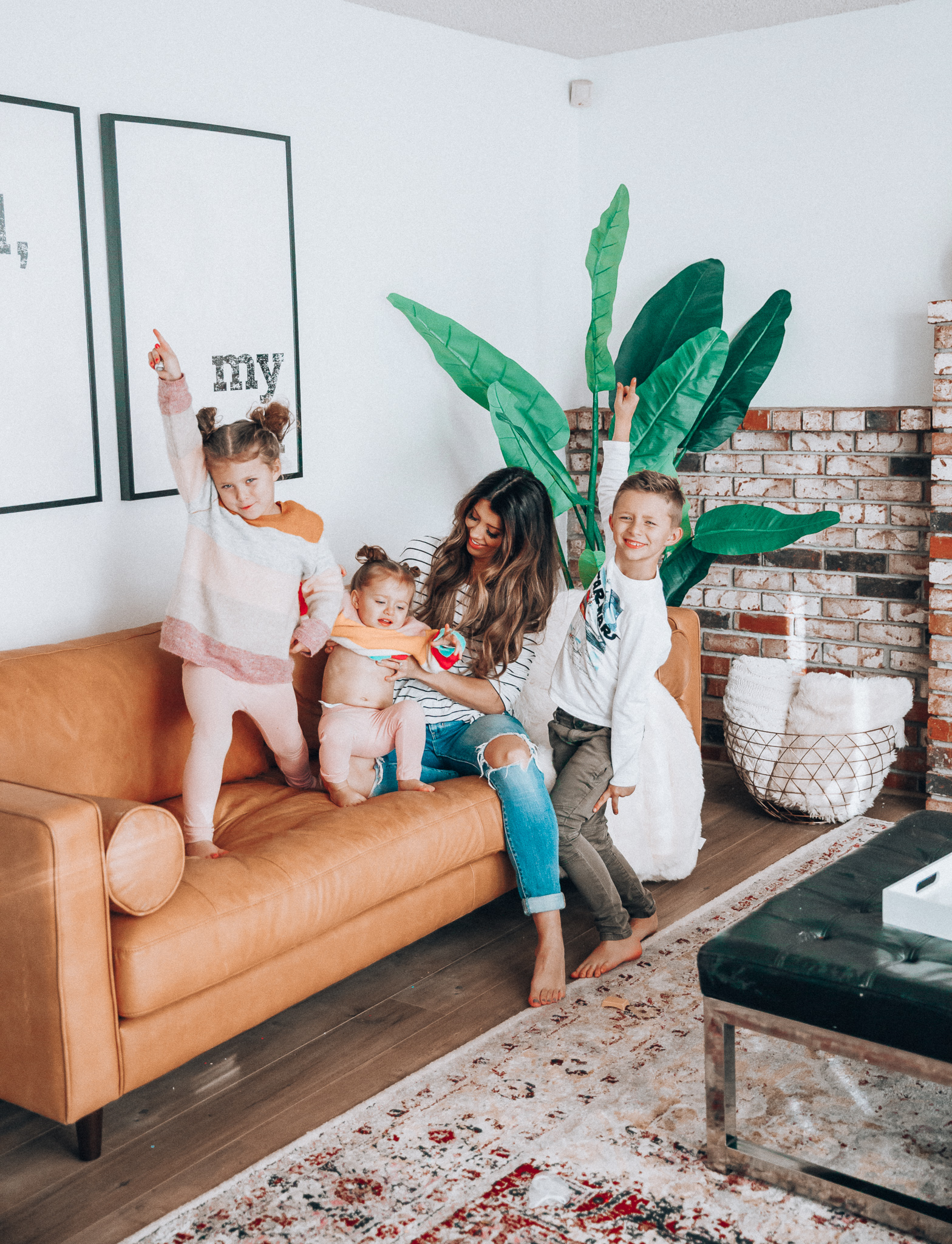 Family Update featured by top US lifestyle blog The Girl in the Yellow Dress; Image of a woman with her kids wearing BP striped tee and Levi's.