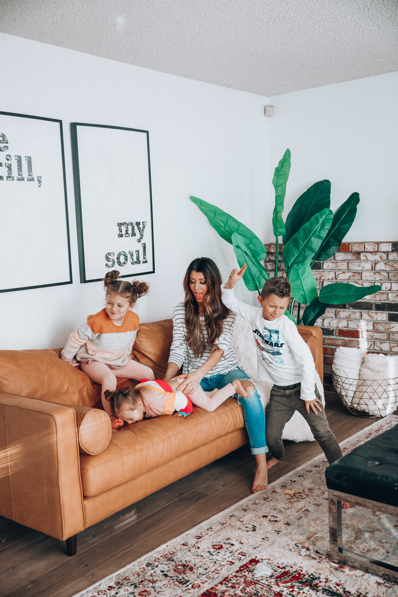 Family Update featured by top US lifestyle blog The Girl in the Yellow Dress; Image of a woman with her kids wearing BP striped tee and Levi's.