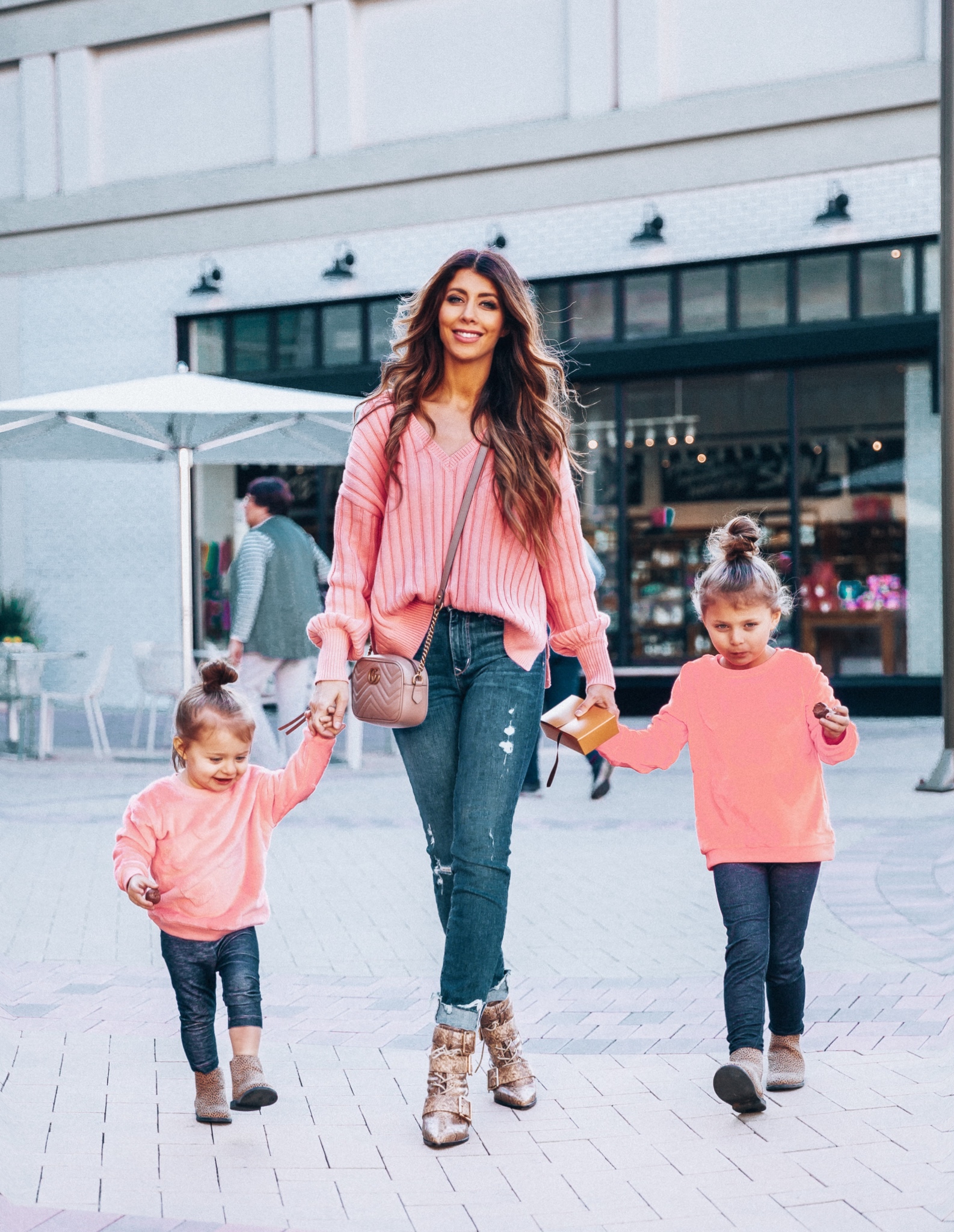 Mommy and Me Valentine's Day Outfit featured by top US fashion blog The Girl in the Yellow Dress; Image of a woman wearing a pink sweater and booties from Revolve.