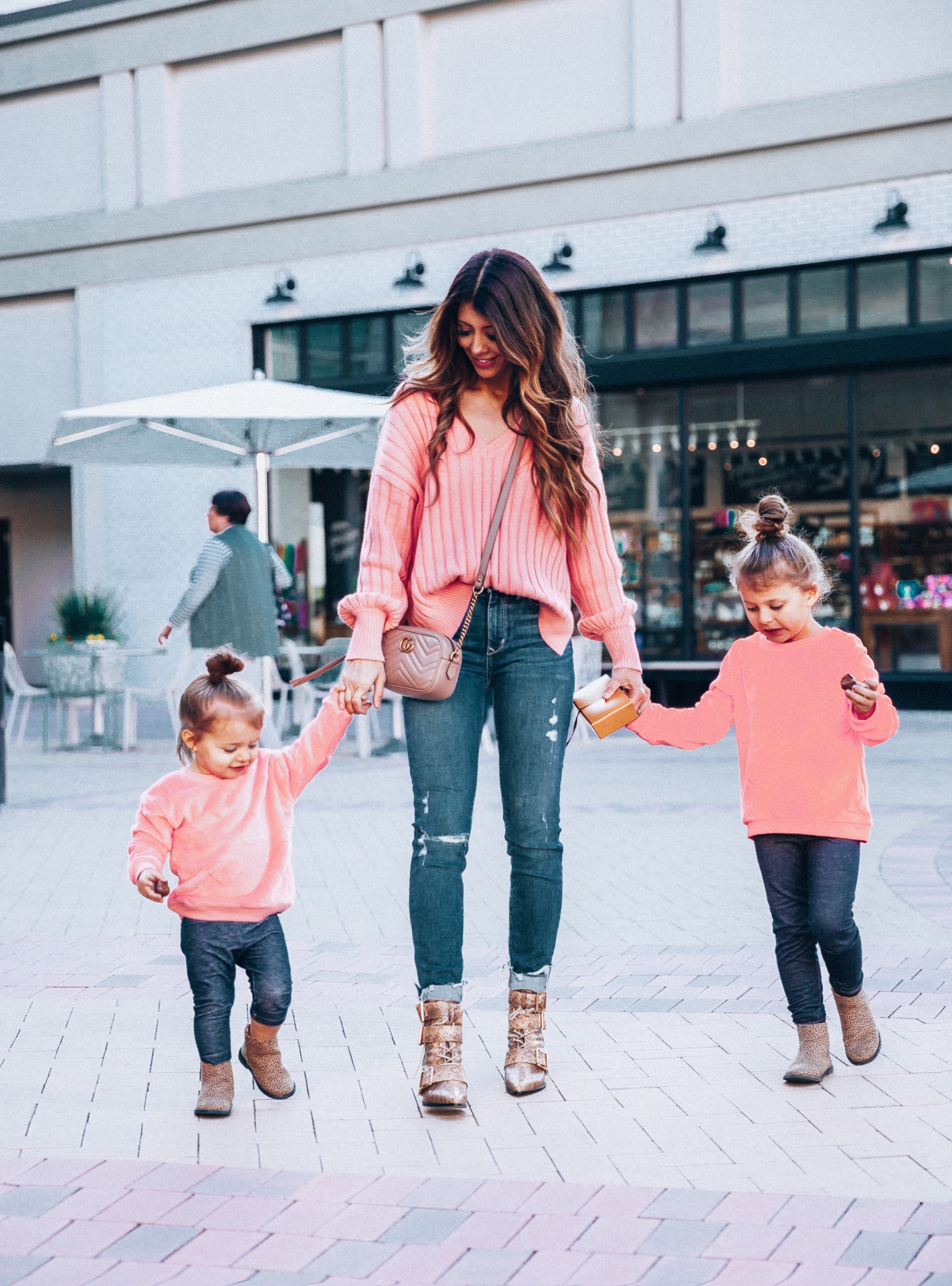 Mommy and Me Valentine's Day Outfit featured by top US fashion blog The Girl in the Yellow Dress; Image of a woman wearing a pink sweater and booties from Revolve.