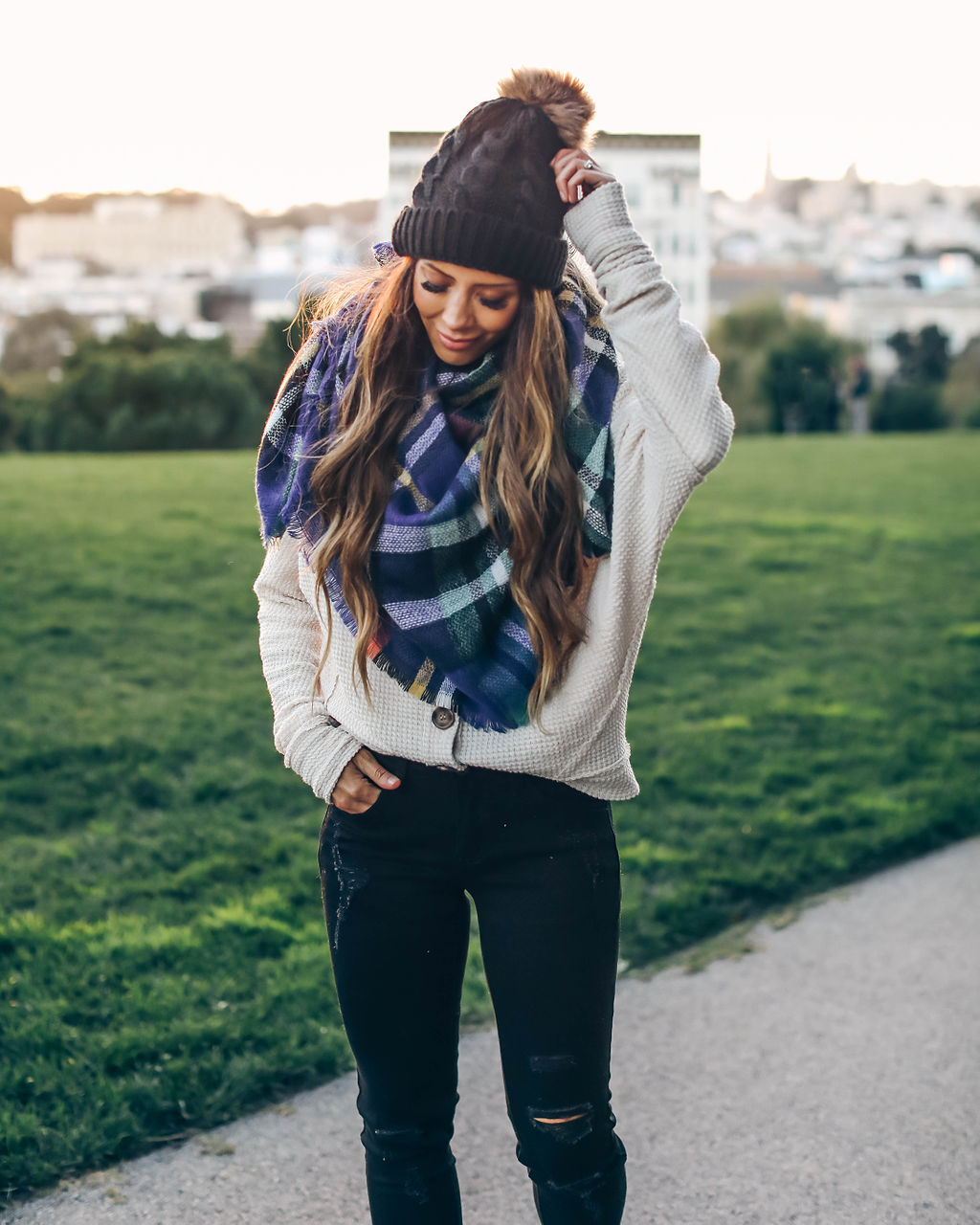 Girls Trip to San Francisco featured by top US fashion blog The Girl in the Yellow Dress; Image of woman wearing pom beanie, button-up sweater and frayed ankle skinny jeans from Vici