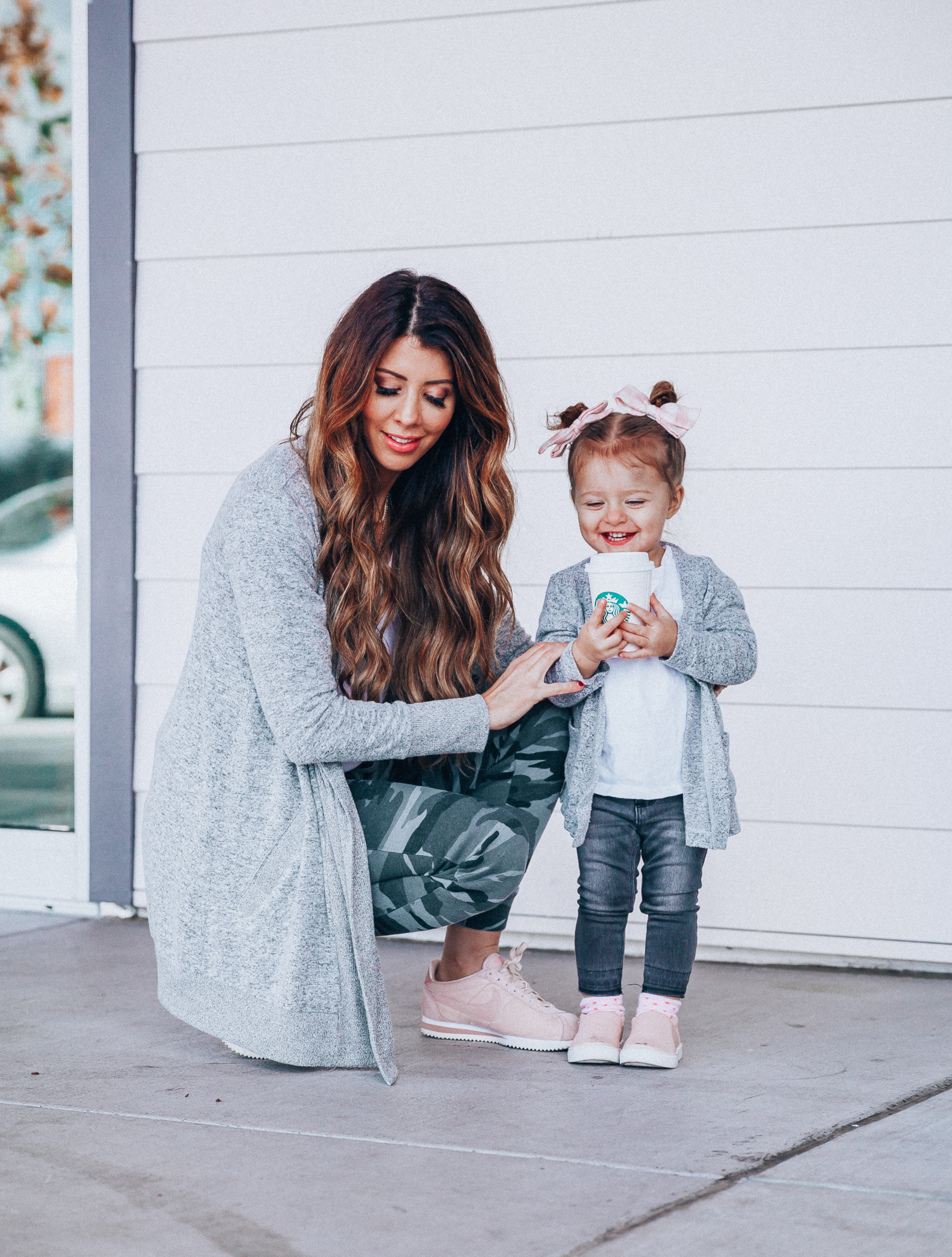 Camo Joggers featured by top US fashion blog The Girl in the Yellow Dress; Image of a woman wearing Nordstrom joggers, BP white tee and Nike shoes.