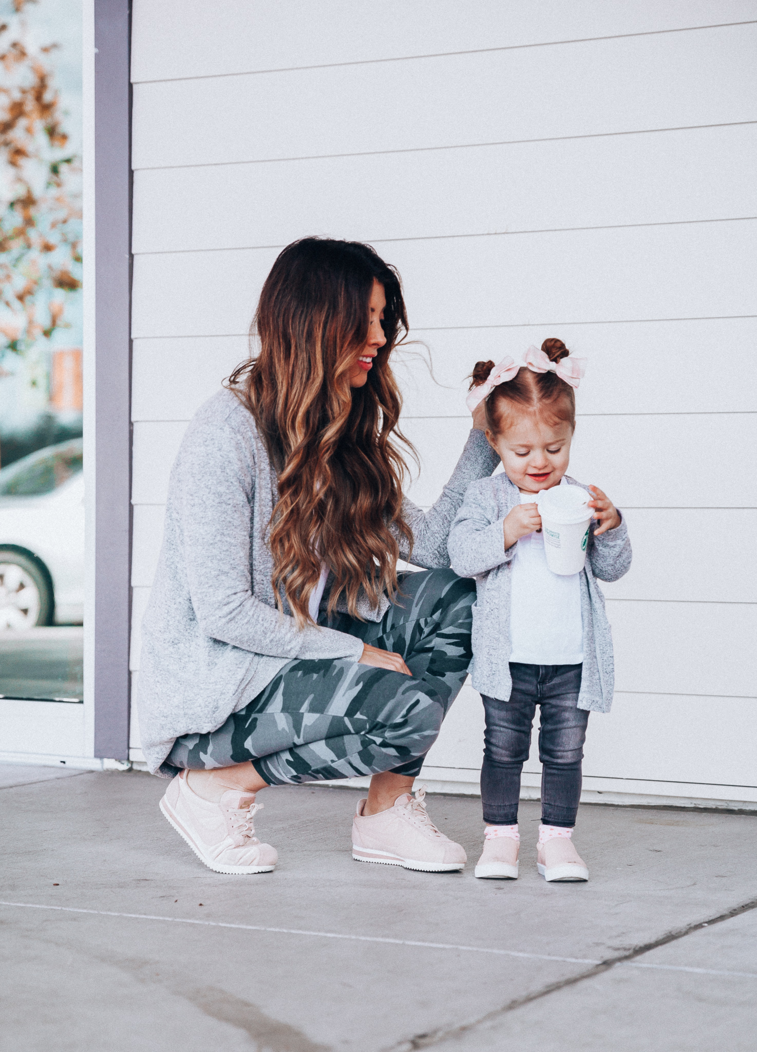 Camo Joggers featured by top US fashion blog The Girl in the Yellow Dress; Image of a woman wearing Nordstrom joggers, BP white tee and Nike shoes.