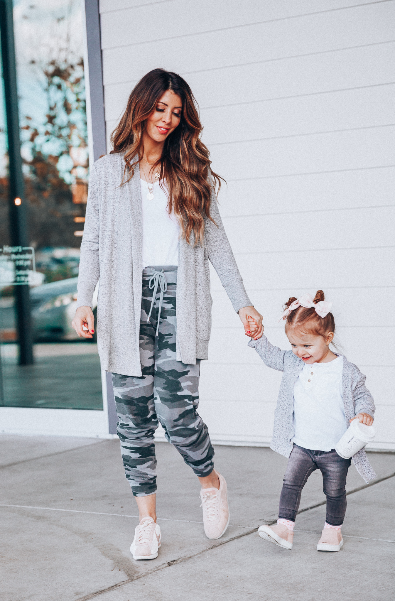 Camo Joggers featured by top US fashion blog The Girl in the Yellow Dress; Image of a woman wearing Nordstrom joggers, BP white tee and Nike shoes.