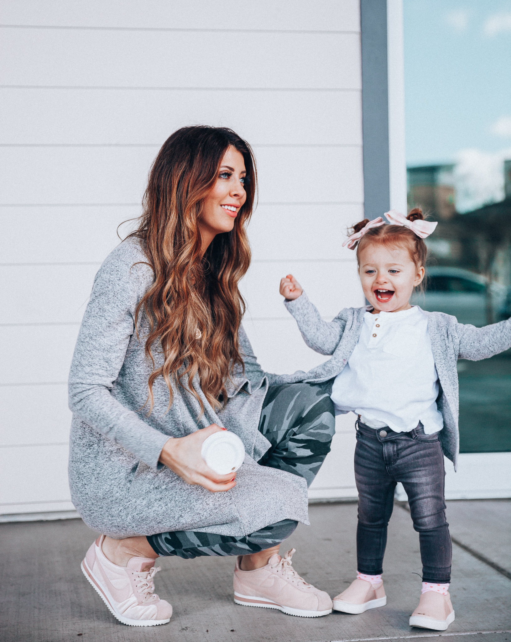 Camo Joggers featured by top US fashion blog The Girl in the Yellow Dress; Image of a woman wearing Nordstrom joggers, BP white tee and Nike shoes.