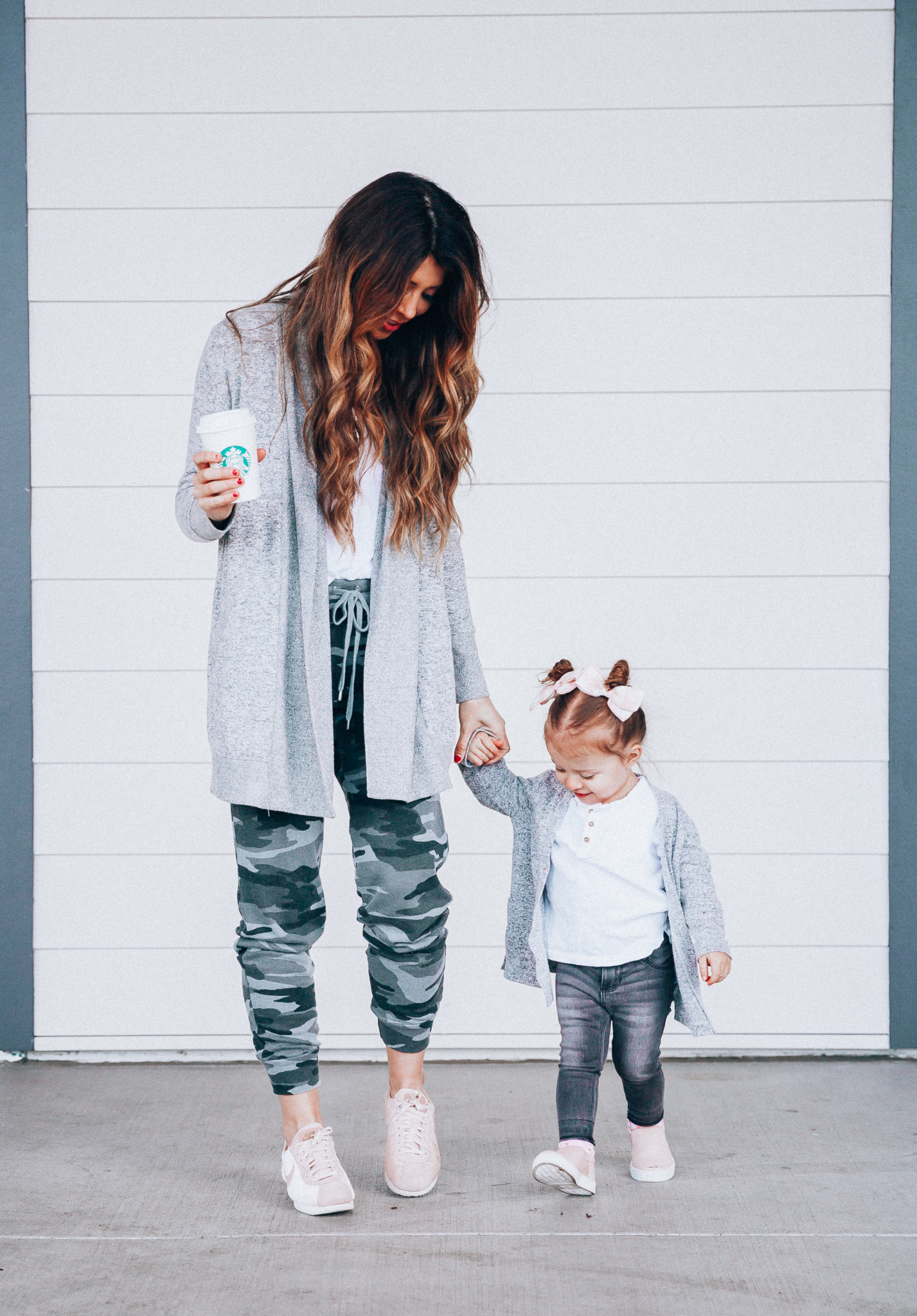 Camo Joggers featured by top US fashion blog The Girl in the Yellow Dress; Image of a woman wearing Nordstrom joggers, BP white tee and Nike shoes.