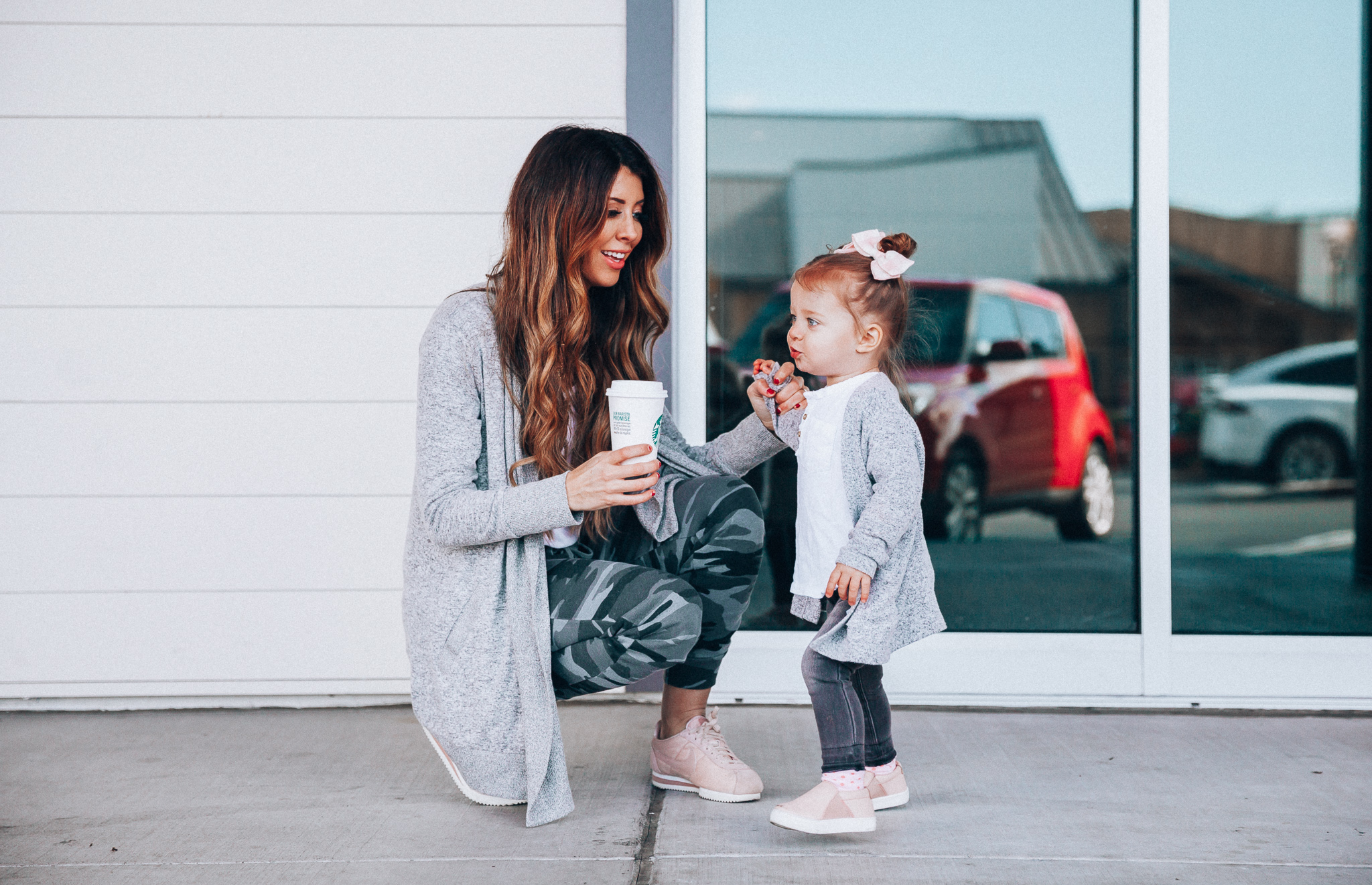 Camo Joggers featured by top US fashion blog The Girl in the Yellow Dress; Image of a woman wearing Nordstrom joggers, BP white tee and Nike shoes.