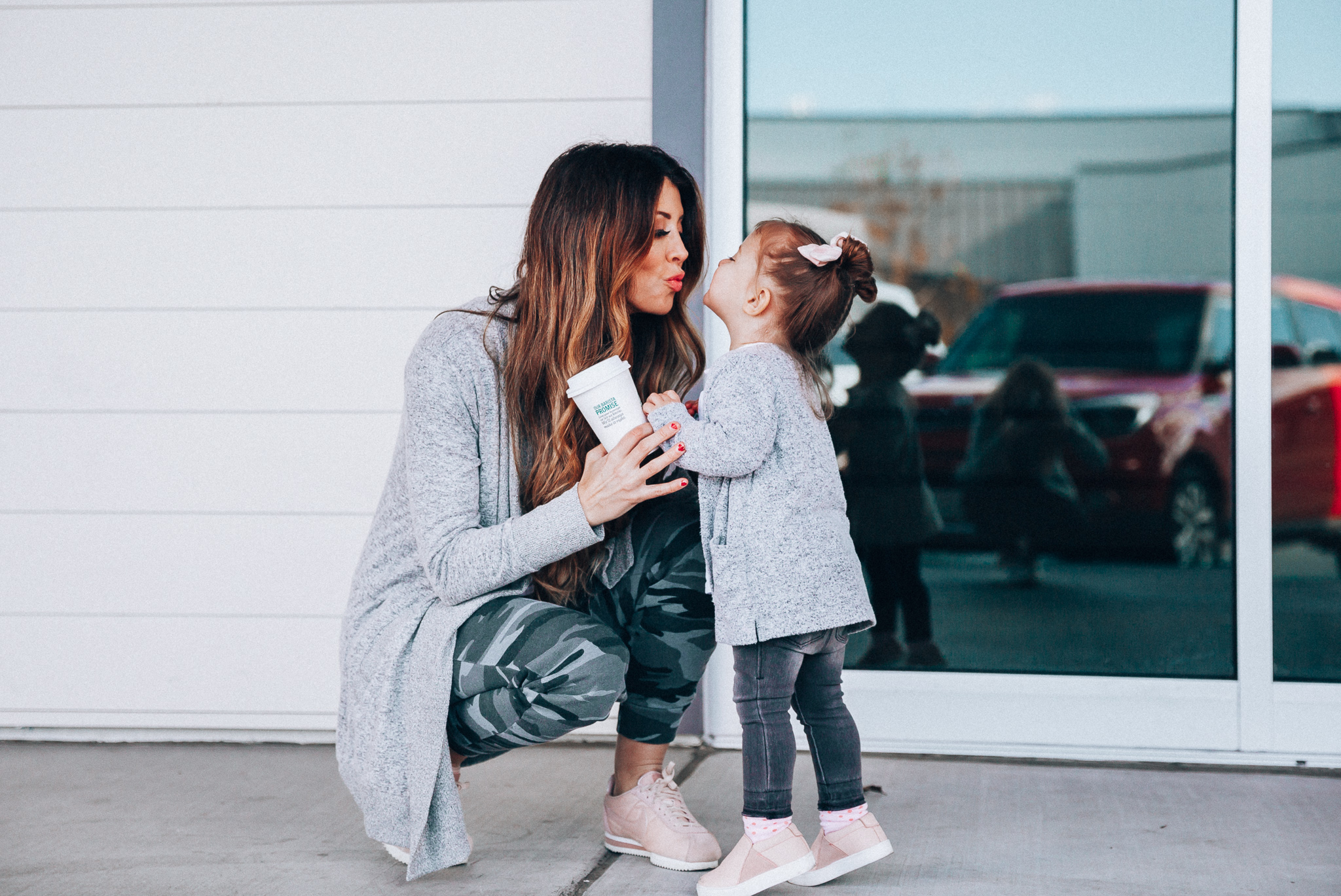 Camo Joggers featured by top US fashion blog The Girl in the Yellow Dress; Image of a woman wearing Nordstrom joggers, BP white tee and Nike shoes.