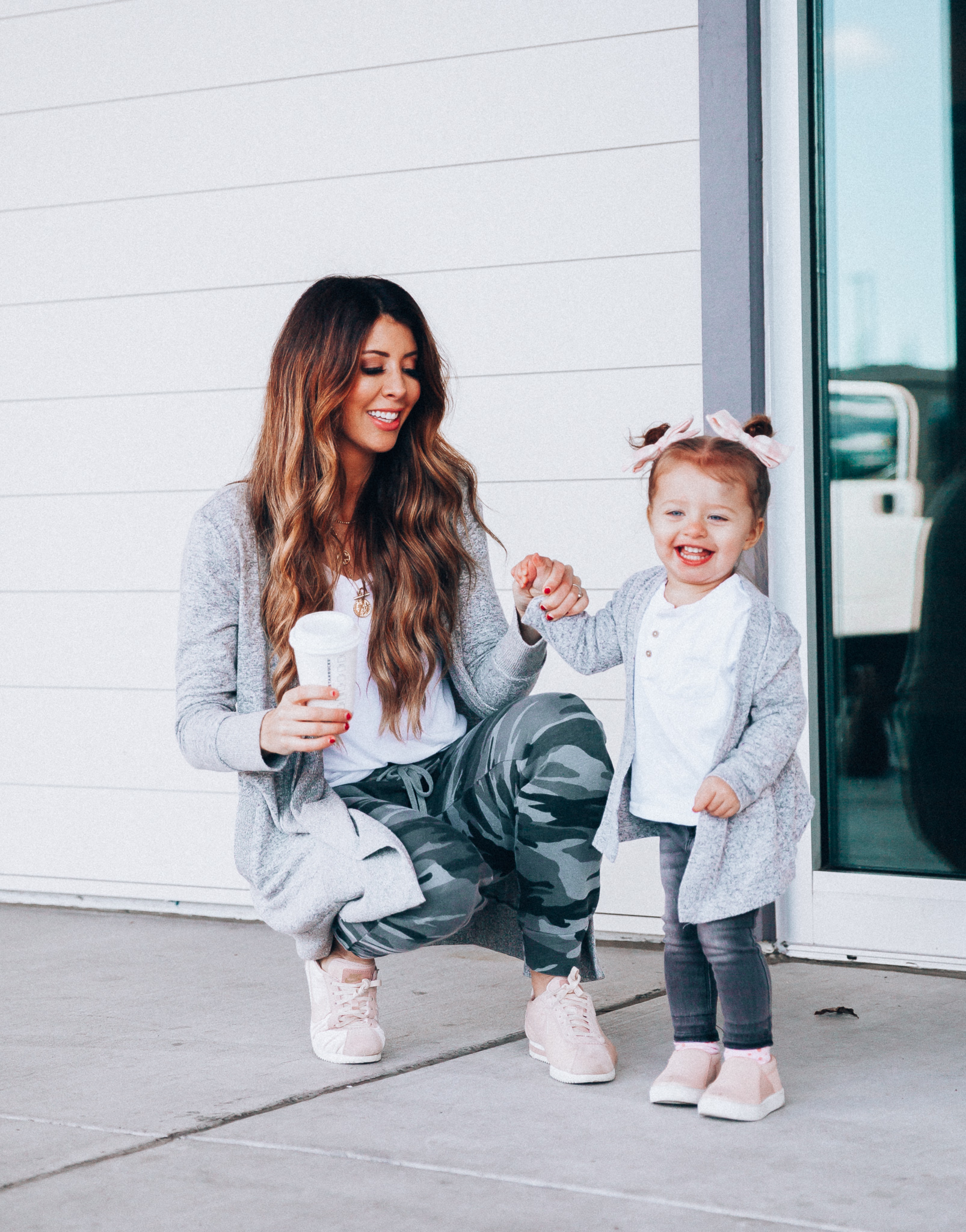 Camo Joggers featured by top US fashion blog The Girl in the Yellow Dress; Image of a woman wearing Nordstrom joggers, BP white tee and Nike shoes.