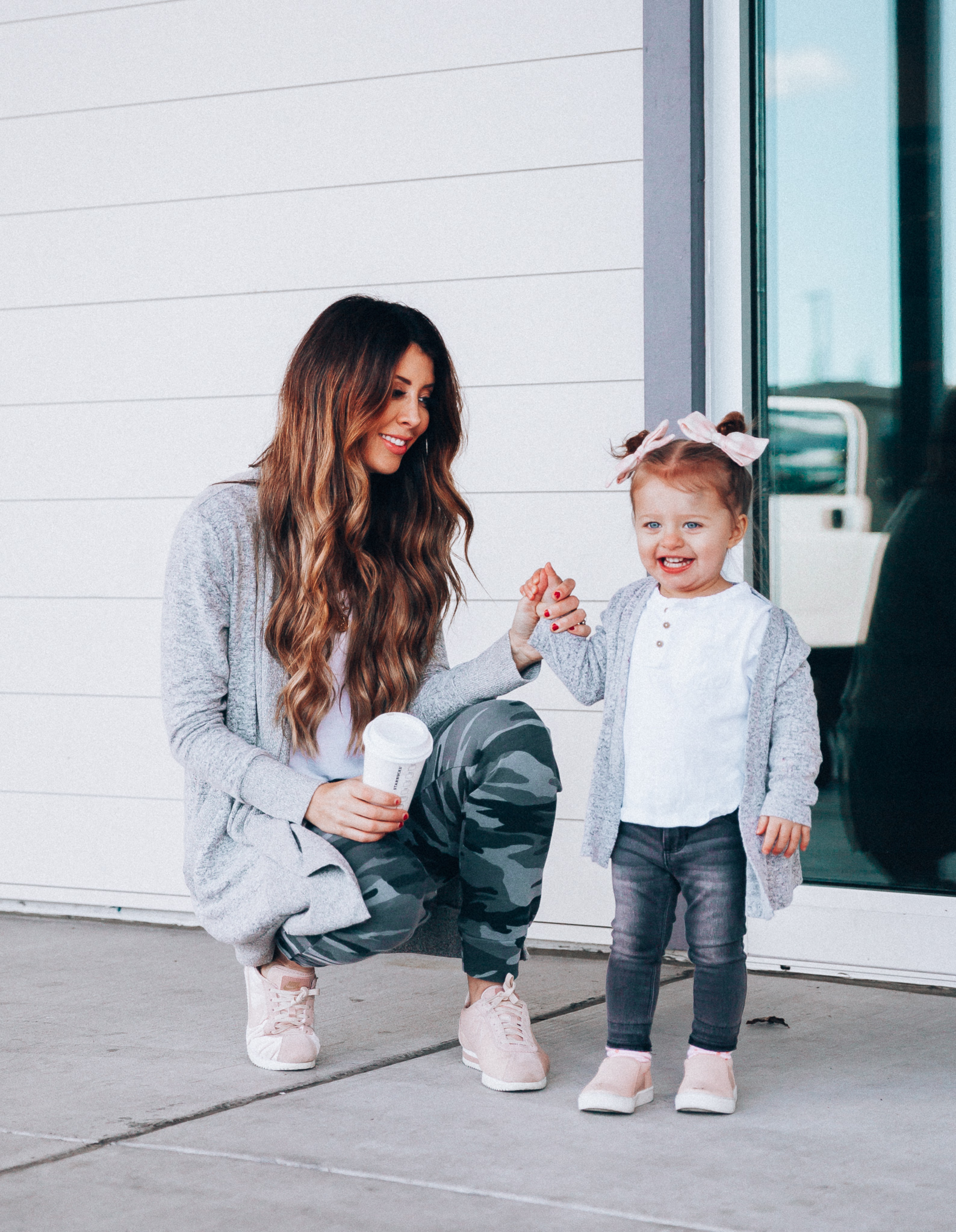 Camo Joggers featured by top US fashion blog The Girl in the Yellow Dress; Image of a woman wearing Nordstrom joggers, BP white tee and Nike shoes.