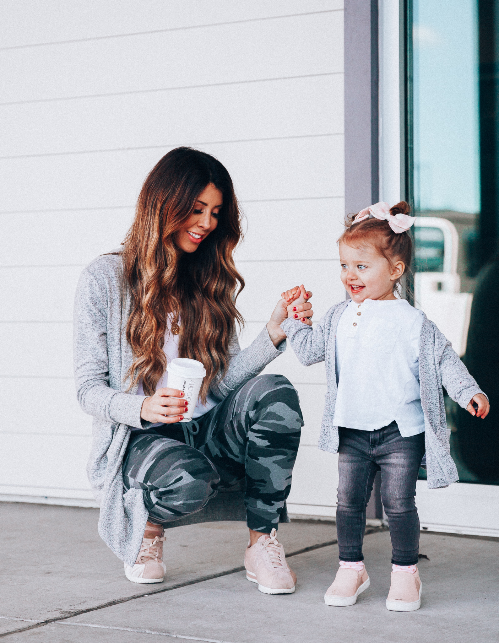 Camo Joggers featured by top US fashion blog The Girl in the Yellow Dress; Image of a woman wearing Nordstrom joggers, BP white tee and Nike shoes.