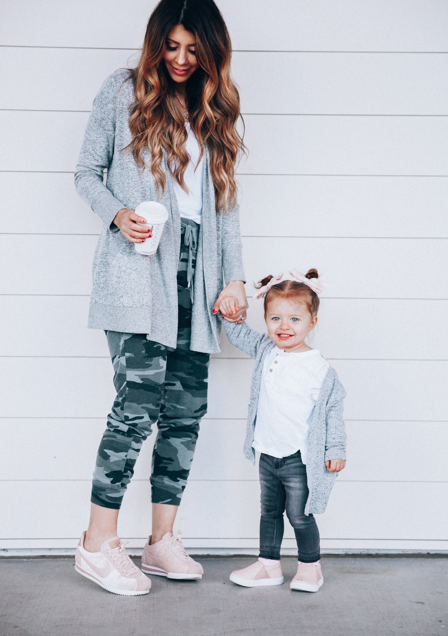 Camo Joggers featured by top US fashion blog The Girl in the Yellow Dress; Image of a woman wearing Nordstrom joggers, BP white tee and Nike shoes.