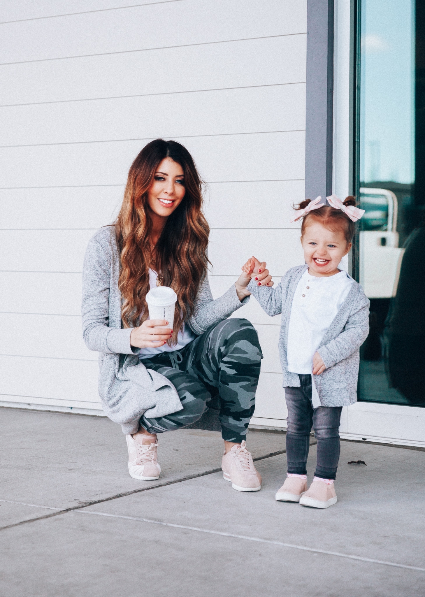 Camo Joggers featured by top US fashion blog The Girl in the Yellow Dress; Image of a woman wearing Nordstrom joggers, BP white tee and Nike shoes.