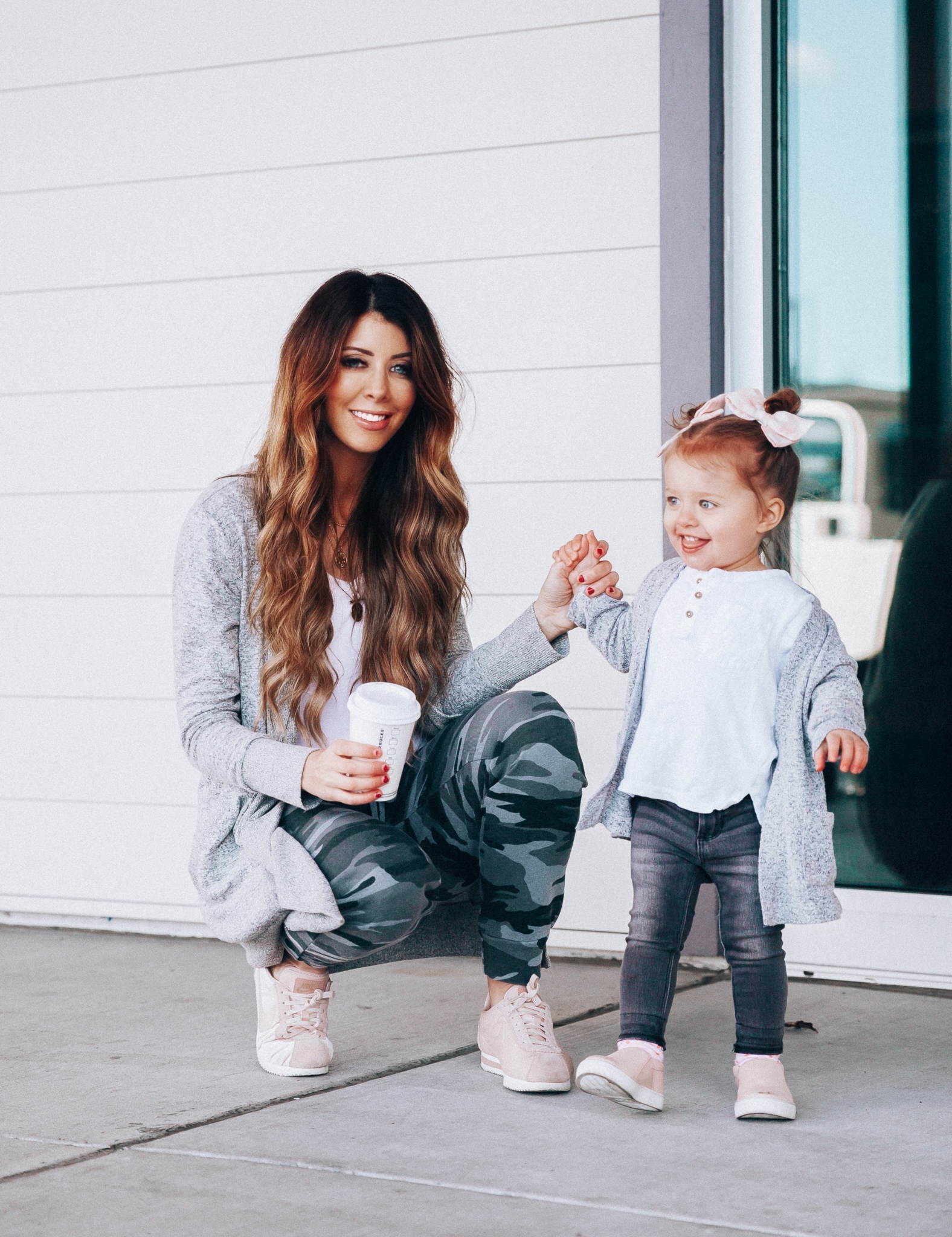 Camo Joggers featured by top US fashion blog The Girl in the Yellow Dress; Image of a woman wearing Nordstrom joggers, BP white tee and Nike shoes.