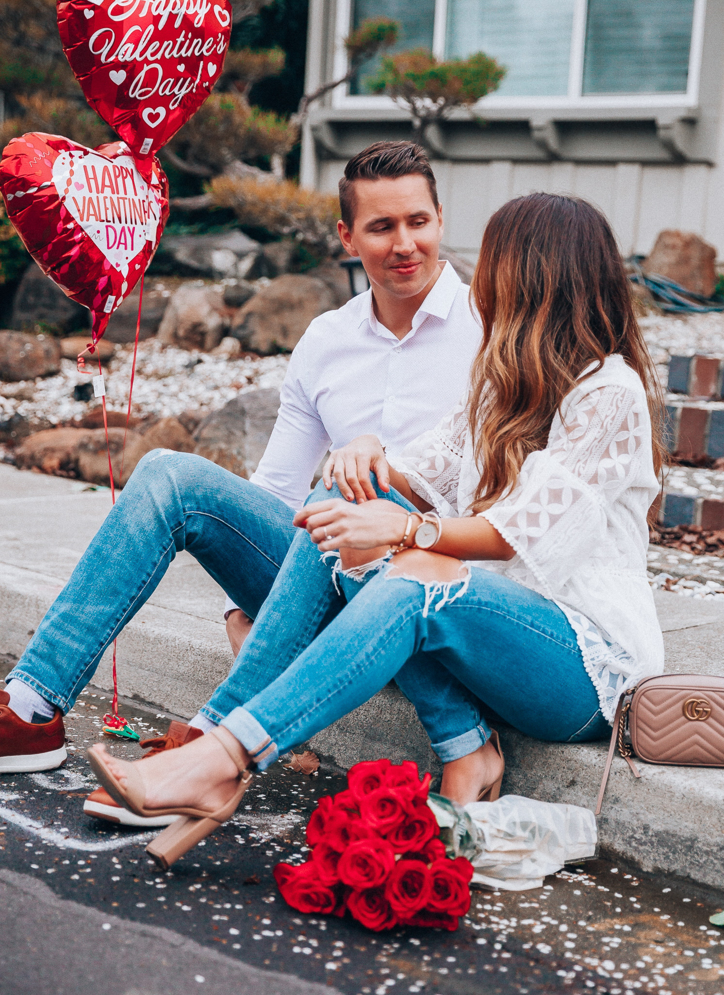 Keep the Spark Alive featured by top US life and style blog The Girl in the Yellow Dress; Image of a woman wearing white top, Shopbop jeans, Sam Edelman shoes and Gucci bag with her husband.