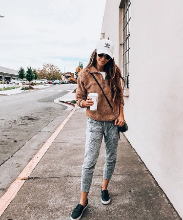 Camo Joggers featured by top US fashion blog The Girl in the Yellow Dress; Image of a woman wearing Nordstrom joggers, BP white tee and Nike shoes.