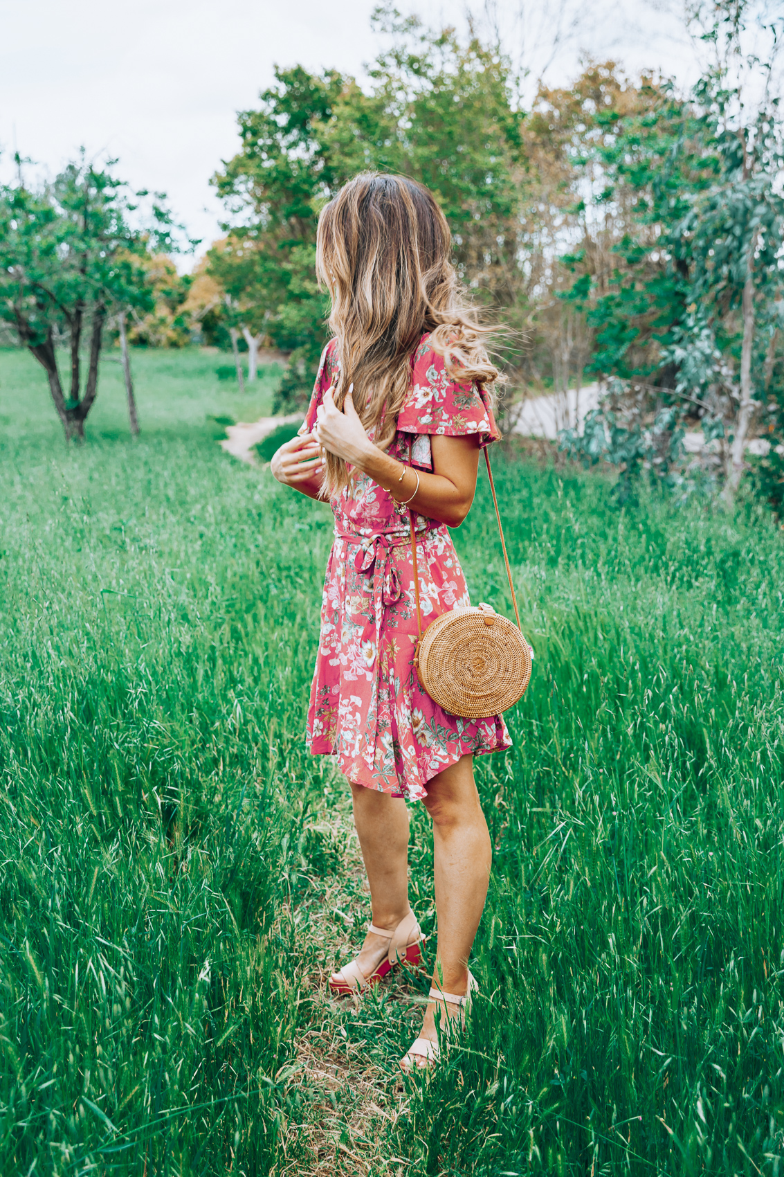 Cute Spring Dresses featured by top US fashion blog The Girl in the Yellow Dress; Image of a woman wearing an Anthropologie dress and Evereve sandals.