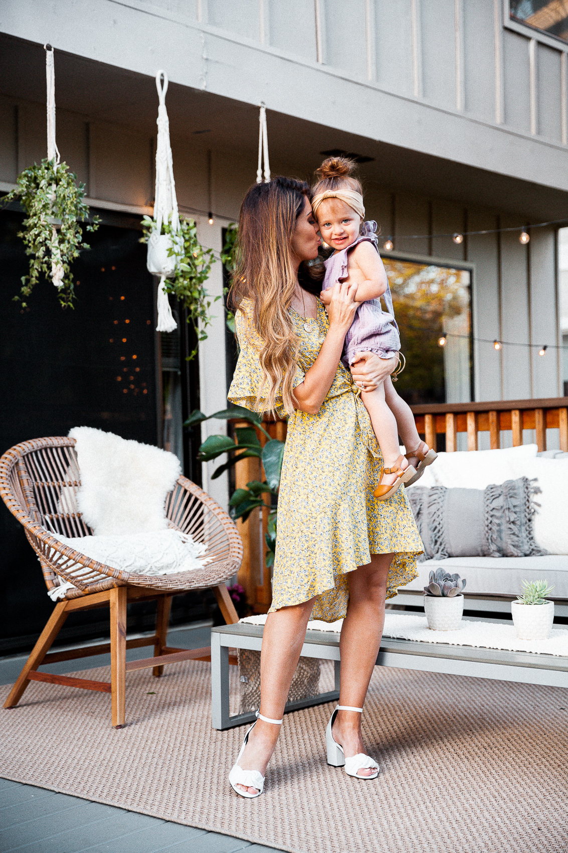 Outdoor Patio Ideas featured by top US fashion blog The Girl in the Yellow Dress; Image of a woman wearing Nordstrom dress and Rebecca Minkoff heels.