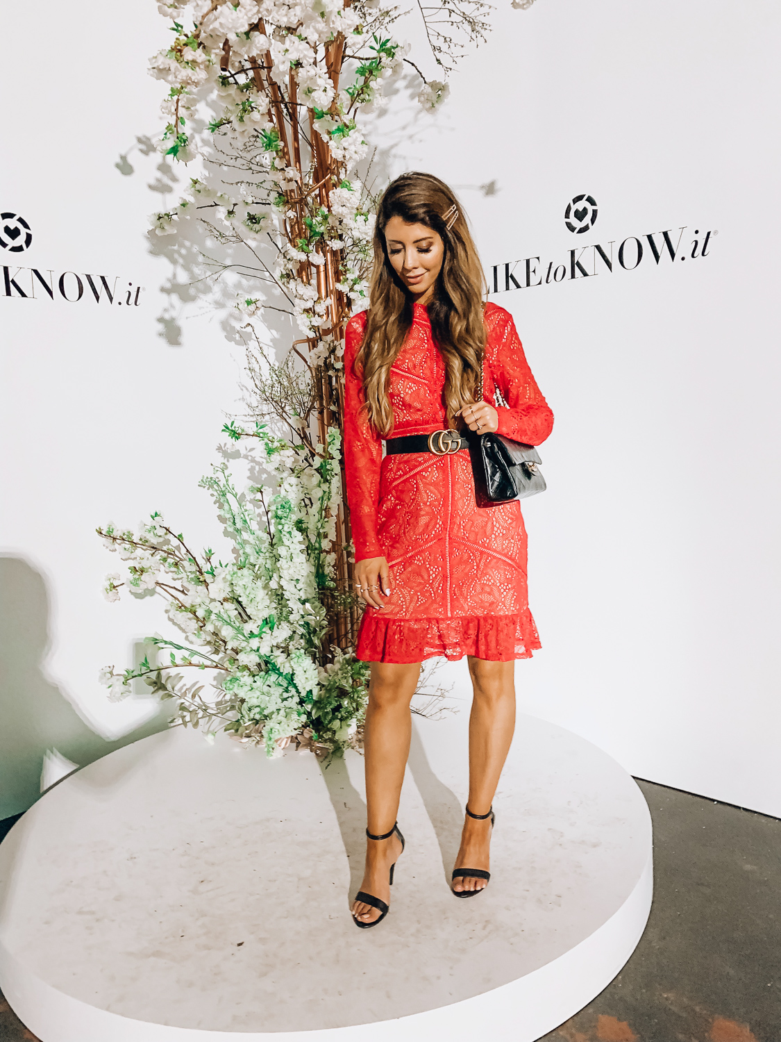 How to Use Like To Know.It featured by top US fashion blog The Girl in the Yellow Dress; Image of a woman wearing Bardot red dress, Gucci belt, Schutz sandals and Chanel bag.