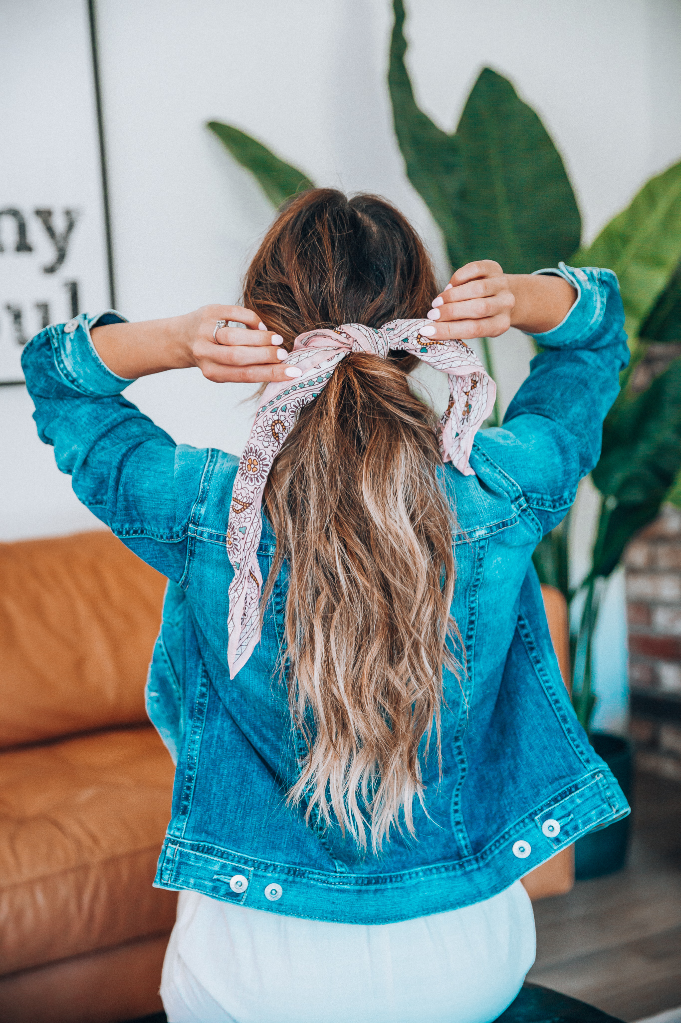 Hair Accessories for Long Hair featured by top US fashion blog The Girl in the Yellow Dress; Image of a woman wearing a denim jacket.