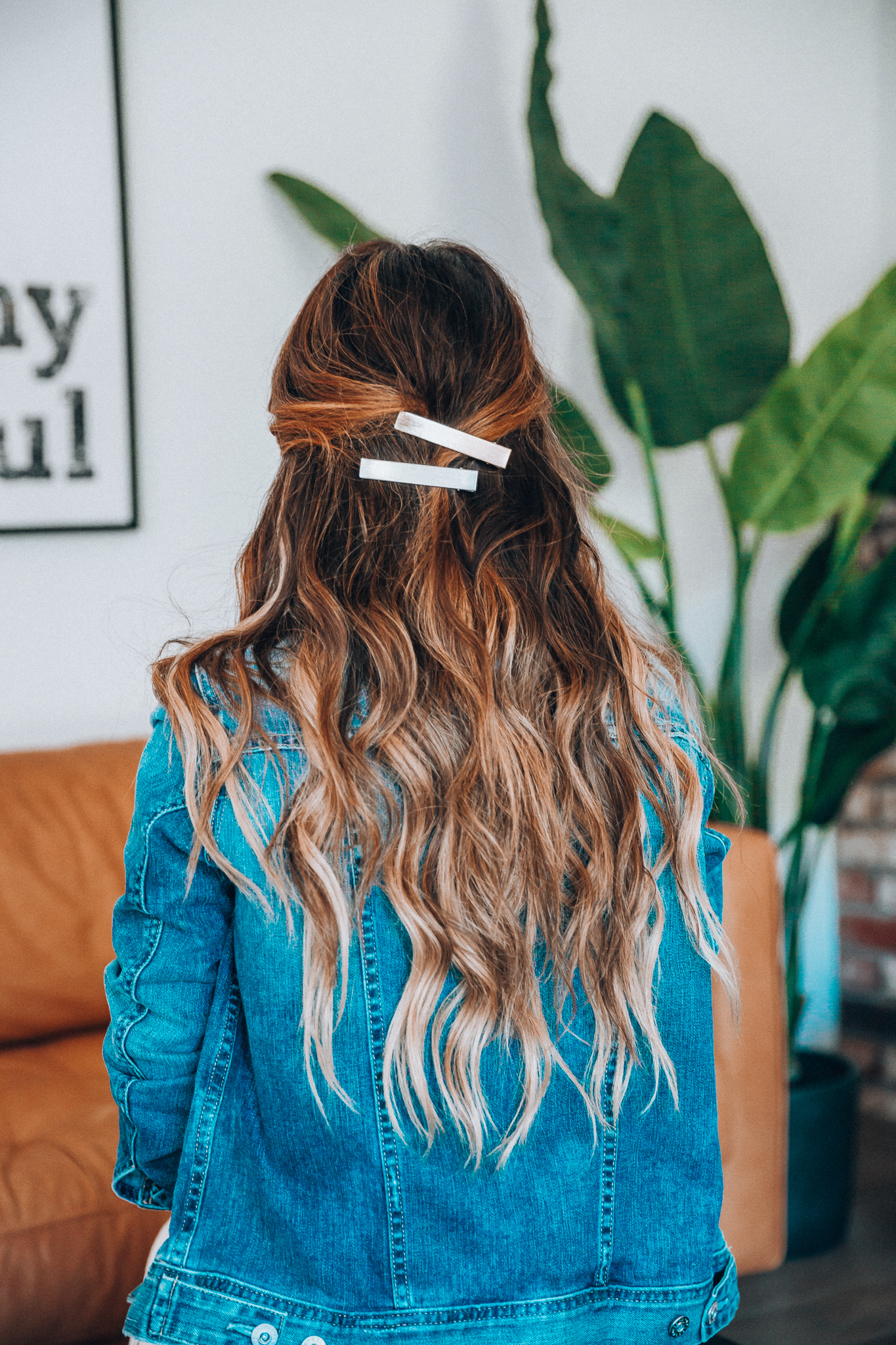 Hair Accessories for Long Hair featured by top US fashion blog The Girl in the Yellow Dress; Image of a woman wearing a denim jacket.