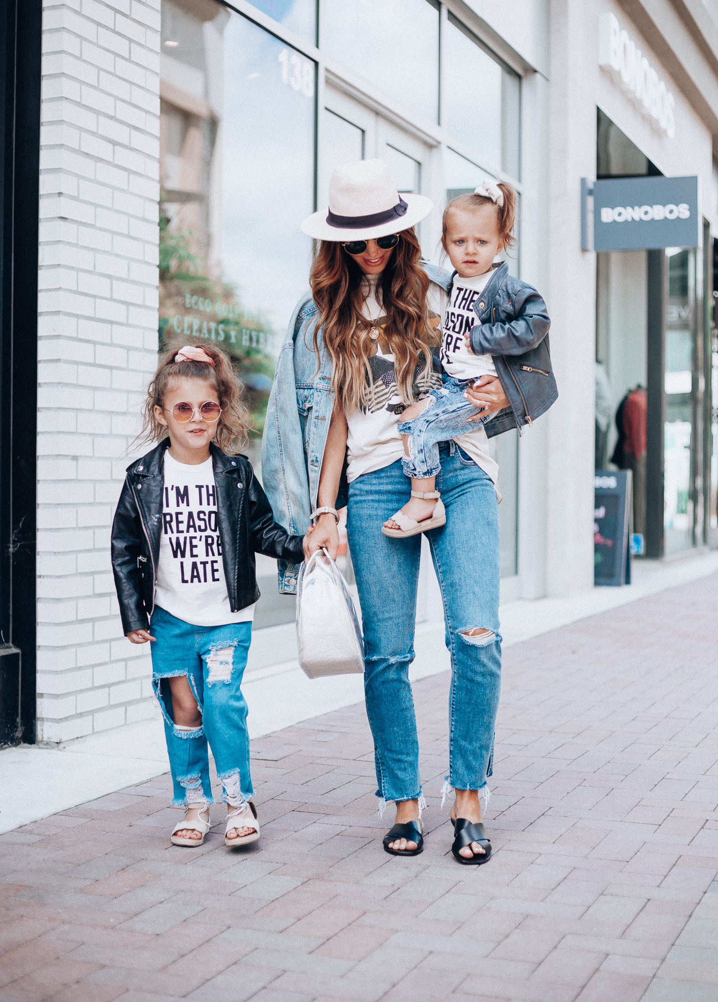 Cute Graphic Tees featured by top US fashion blog The Girl in the Yellow Dress; Image of a woman wearing a graphic tee and jeans.