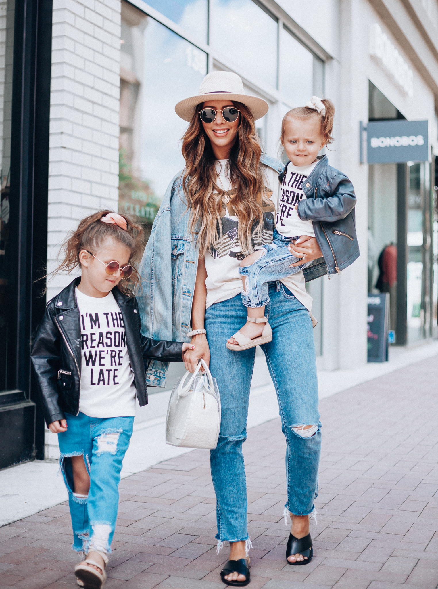 Cute Graphic Tees featured by top US fashion blog The Girl in the Yellow Dress; Image of a woman wearing a graphic tee and jeans.