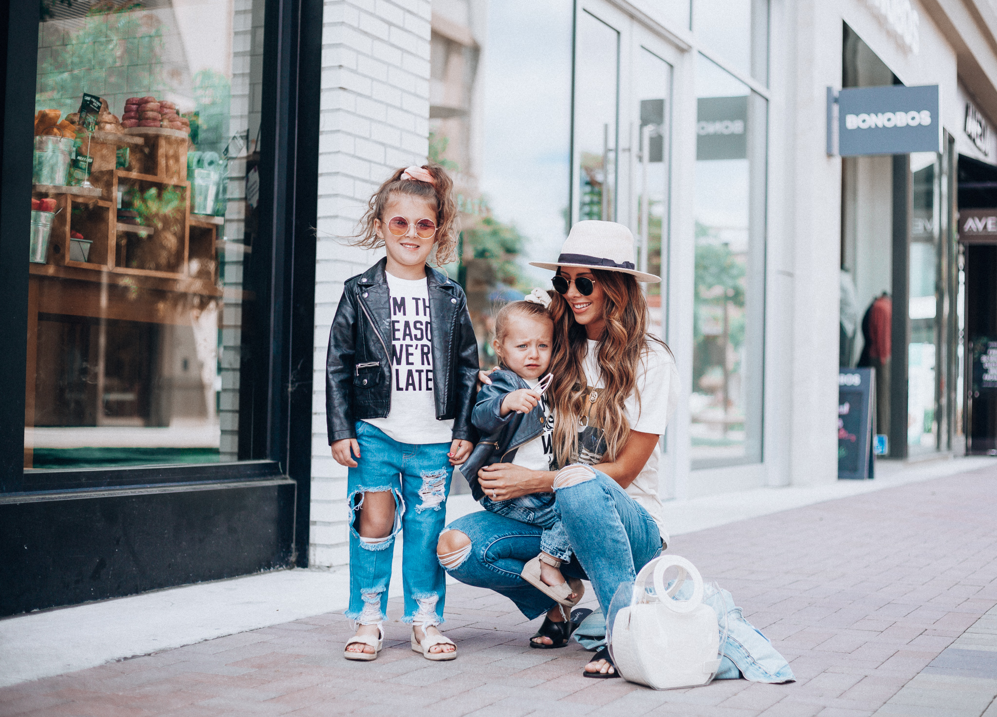 Cute Graphic Tees featured by top US fashion blog The Girl in the Yellow Dress; Image of a woman wearing a graphic tee and jeans.