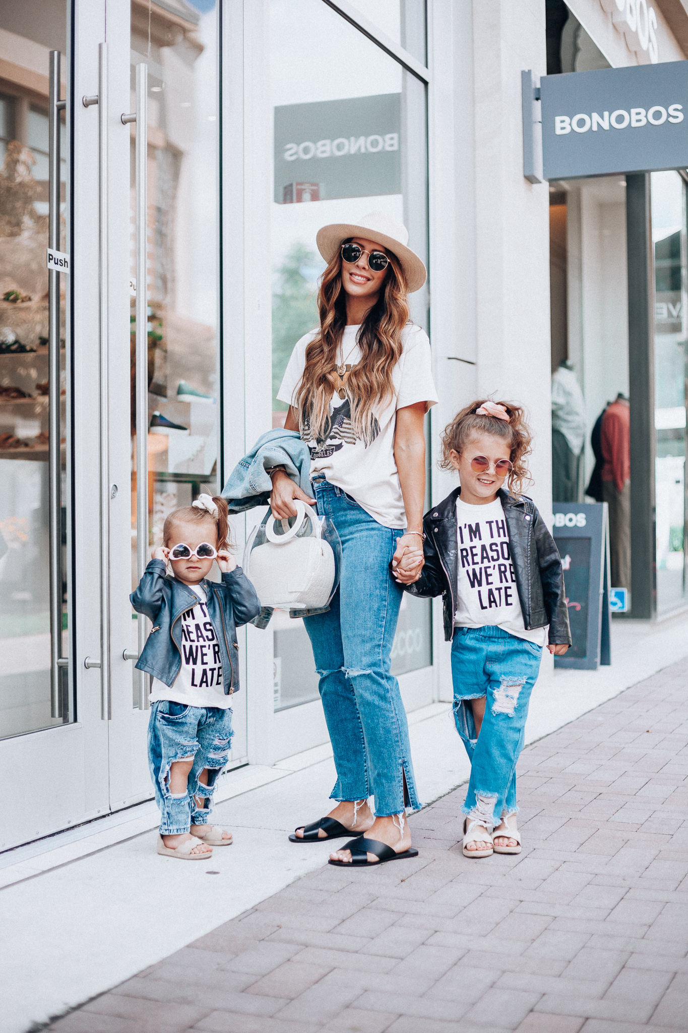 Cute Graphic Tees featured by top US fashion blog The Girl in the Yellow Dress; Image of a woman wearing a graphic tee and jeans.